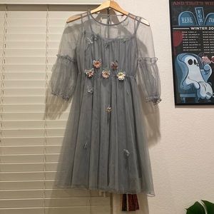 Silver party dress with flower and butterfly accents